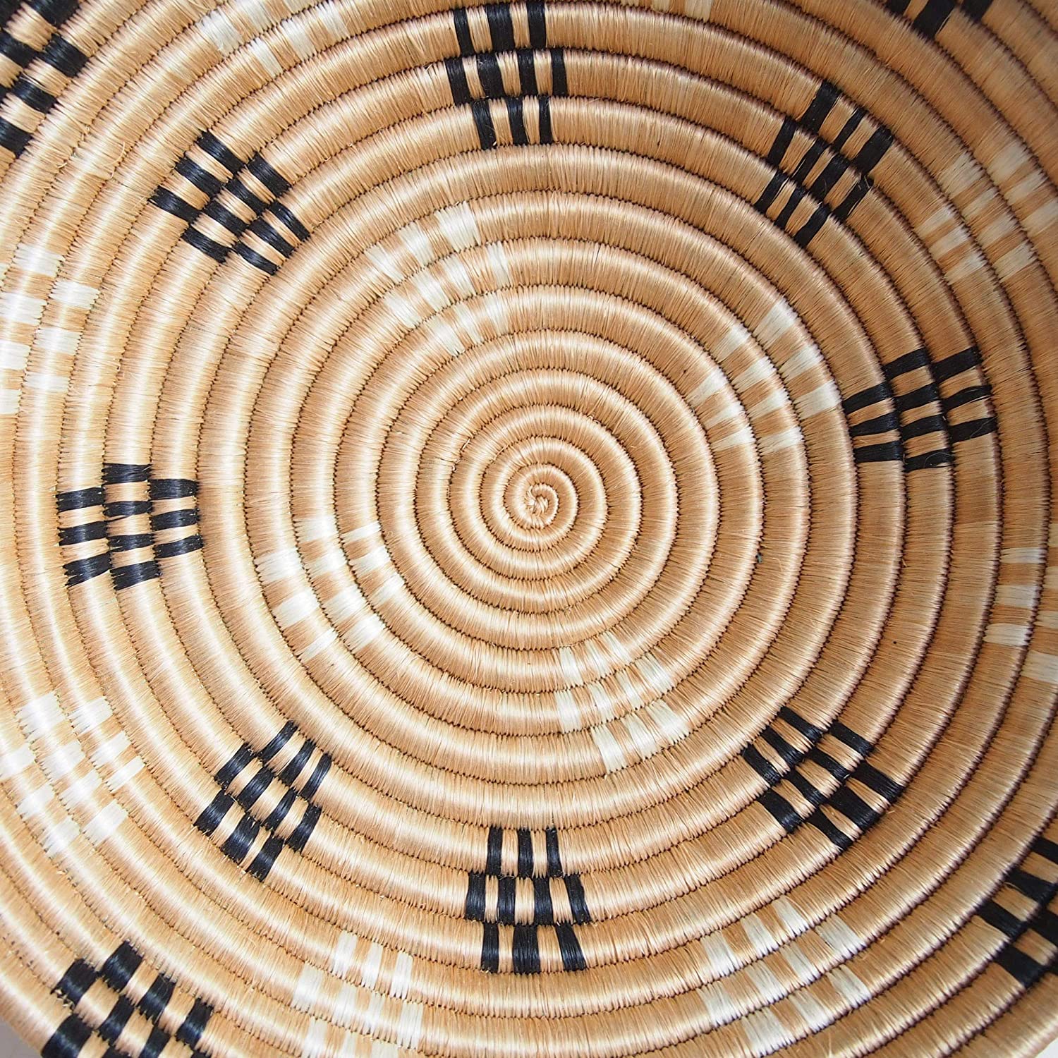 A beautifully handwoven African sisal basket featuring vibrant colors, perfect for fruits or wall decoration, showcasing Rwandan craftsmanship.