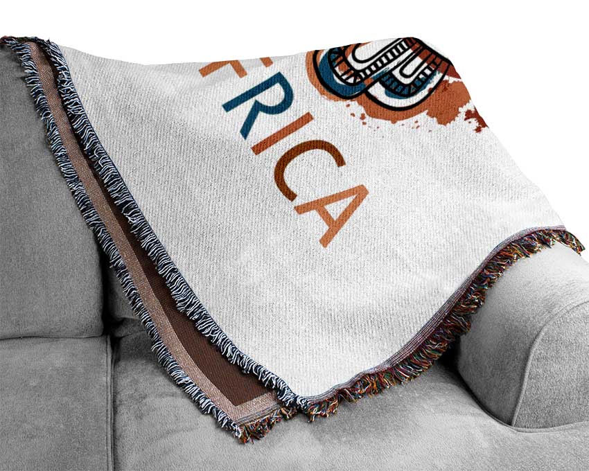 A luxurious African Mask throw made from 100% cotton, featuring a unique thermal weave and intricate design, perfect for enhancing home decor.