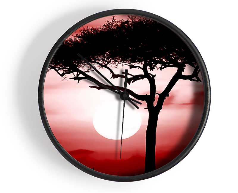 African Safari Red clock made from natural bamboo with a round face and clear Plexiglas lens, available in multiple colors.