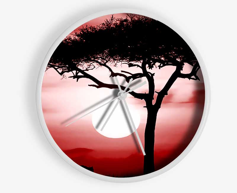 African Safari Red clock made from natural bamboo with a round face and clear Plexiglas lens, available in multiple colors.