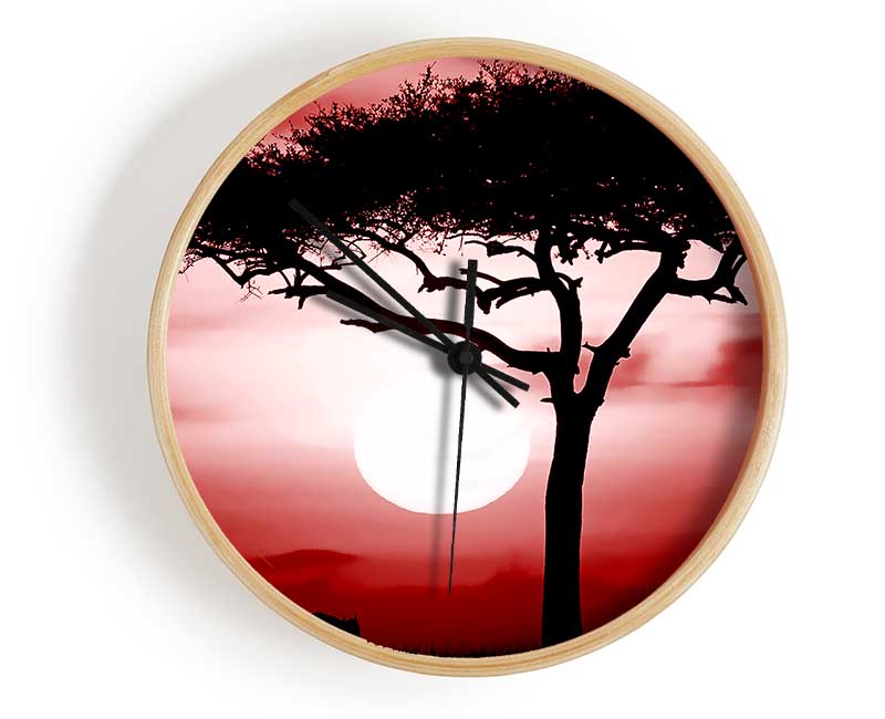 African Safari Red clock made from natural bamboo with a round face and clear Plexiglas lens, available in multiple colors.