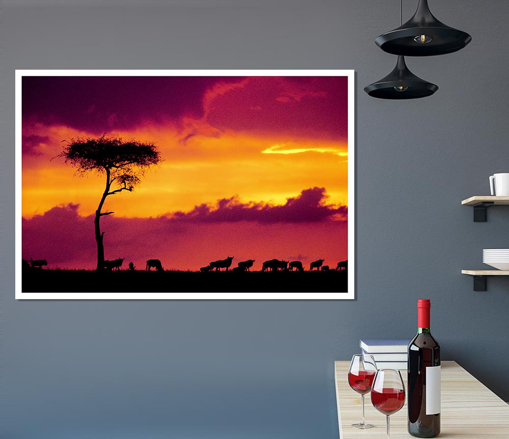 A stunning canvas print of an African sunset over the savannah, showcasing vibrant colors and silhouettes of trees.