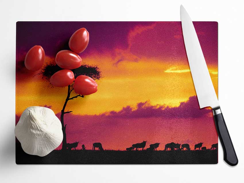 A beautifully designed chopping board featuring an African Safari Sunset, made from durable tempered glass with a chinchilla ripple effect.