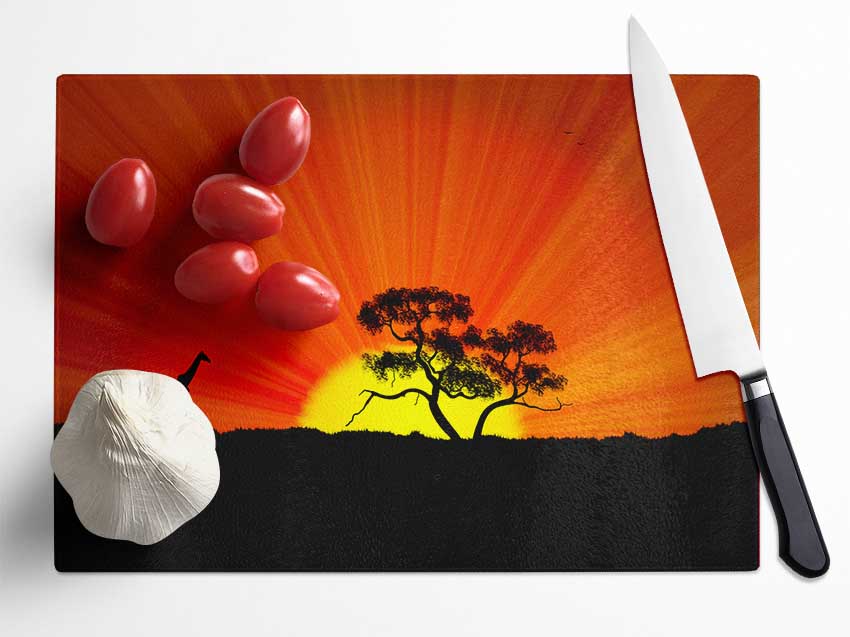 African Sunblaze chopping board made from tempered glass with chinchilla ripple effect and anti-slip feet.