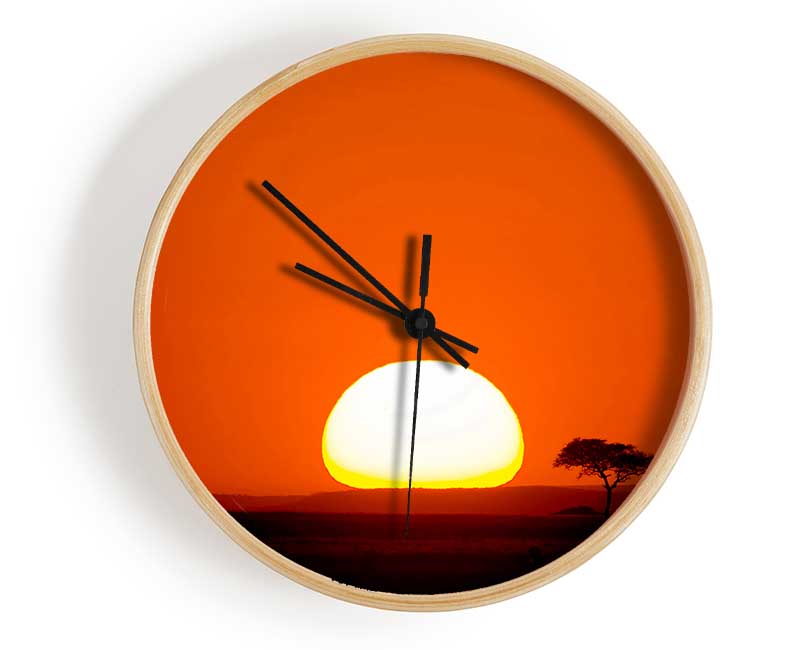 African Sunrise clock made from natural bamboo with a round face, available in black, white, and natural frame colors.