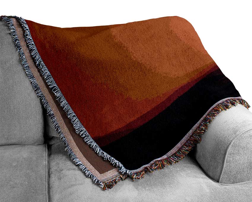 A luxurious African Sunrise throw blanket made from 100% cotton, featuring a thermal weave design in warm, inviting colors.