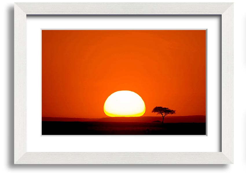 A beautifully framed print of an African sunrise, showcasing vibrant colors and landscape details, ready to hang.