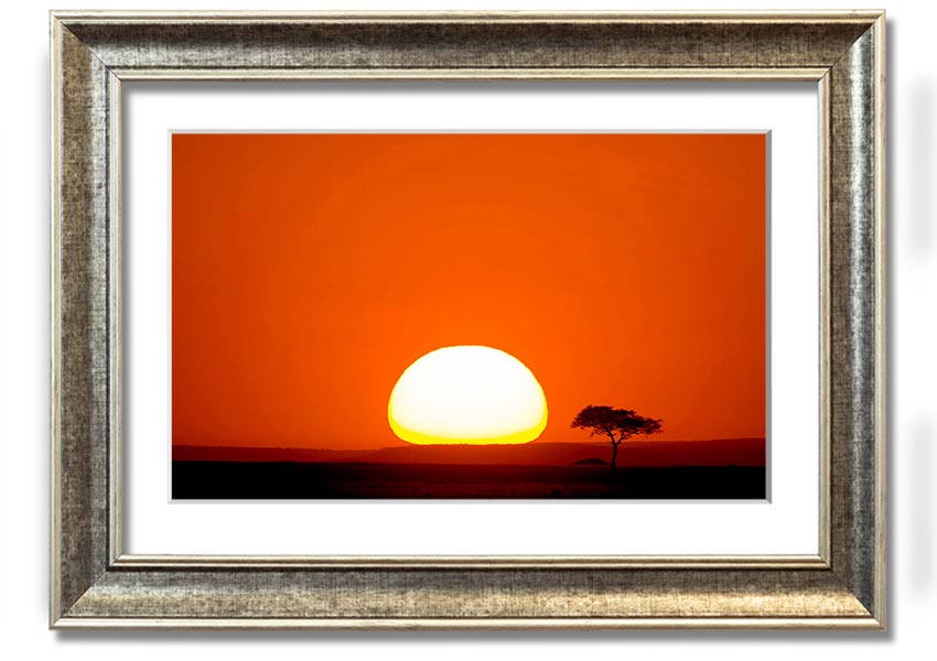 A beautifully framed print of an African sunrise, showcasing vibrant colors and landscape details, ready to hang.