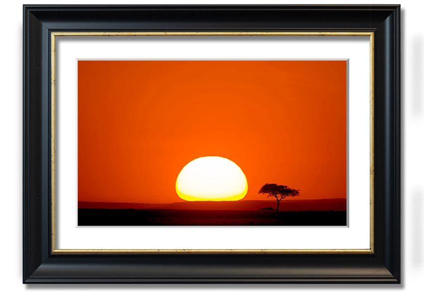 A beautifully framed print of an African sunrise, showcasing vibrant colors and landscape details, ready to hang.