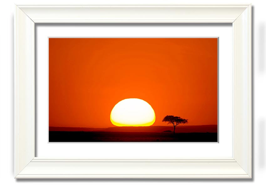 A beautifully framed print of an African sunrise, showcasing vibrant colors and landscape details, ready to hang.