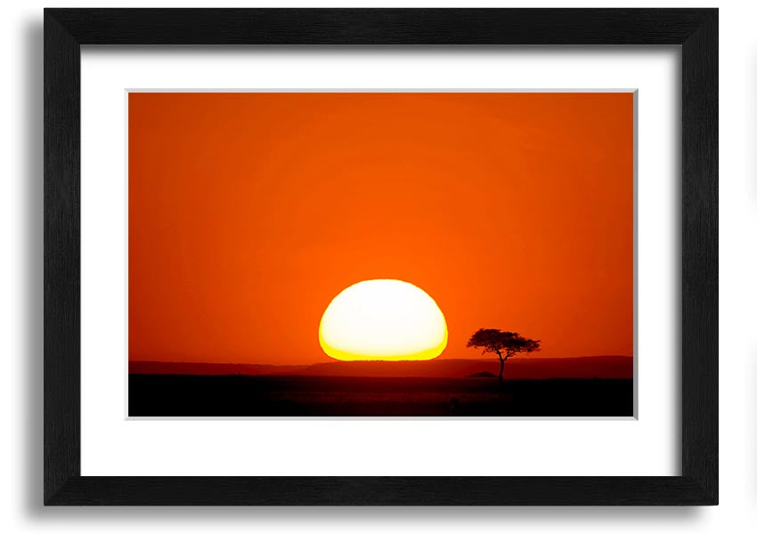 A beautifully framed print of an African sunrise, showcasing vibrant colors and landscape details, ready to hang.