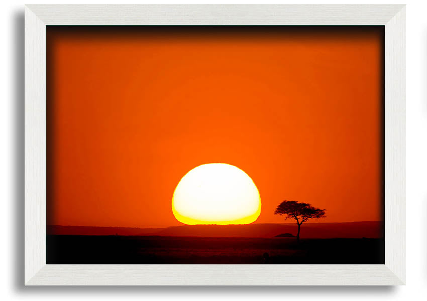 A beautifully framed print of an African sunrise, showcasing vibrant colors and landscape details, ready to hang.