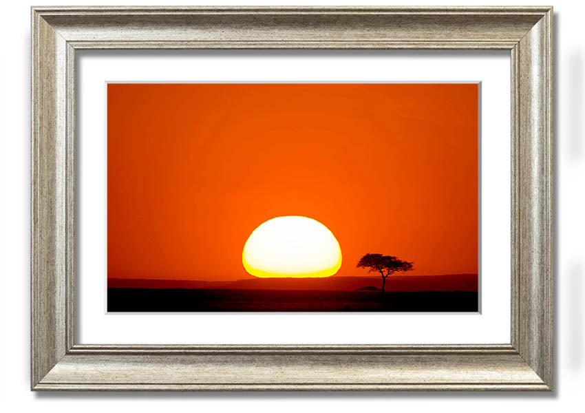 A beautifully framed print of an African sunrise, showcasing vibrant colors and landscape details, ready to hang.