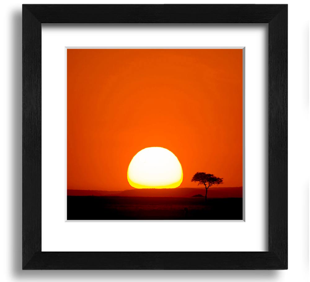 A beautifully framed print of an African sunrise, showcasing vibrant colors and stunning landscape details.