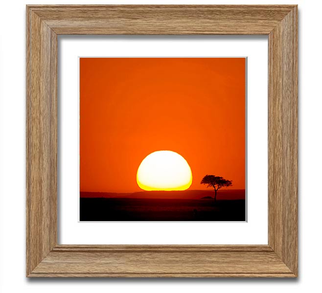 A beautifully framed print of an African sunrise, showcasing vibrant colors and stunning landscape details.