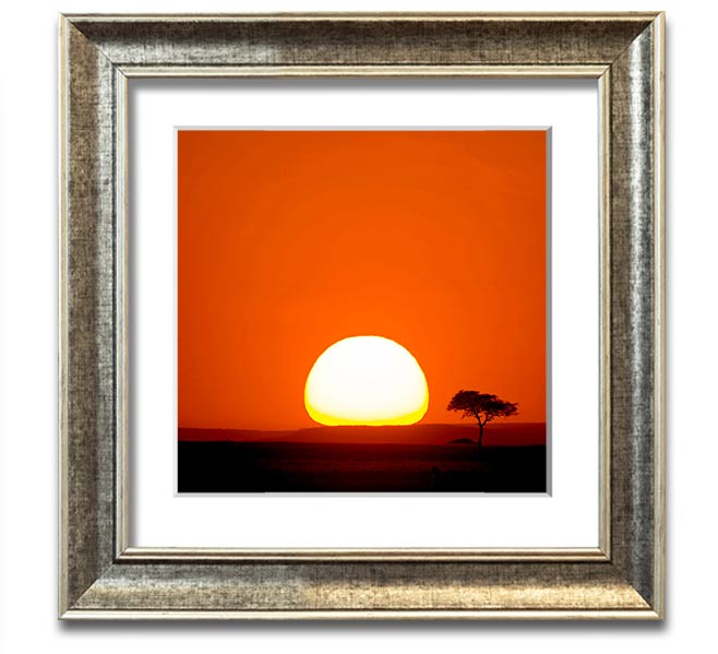 A beautifully framed print of an African sunrise, showcasing vibrant colors and stunning landscape details.