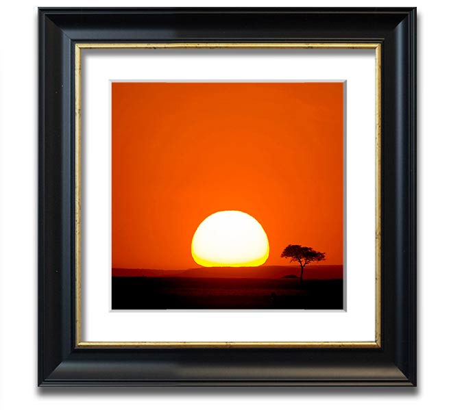 A beautifully framed print of an African sunrise, showcasing vibrant colors and stunning landscape details.