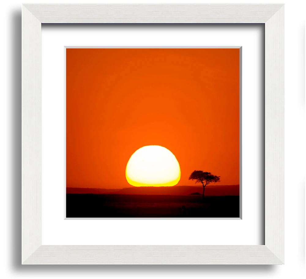 A beautifully framed print of an African sunrise, showcasing vibrant colors and stunning landscape details.