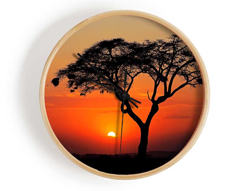 African Sunset clock made from natural bamboo with a round face, available in black, white, and natural frame colors.