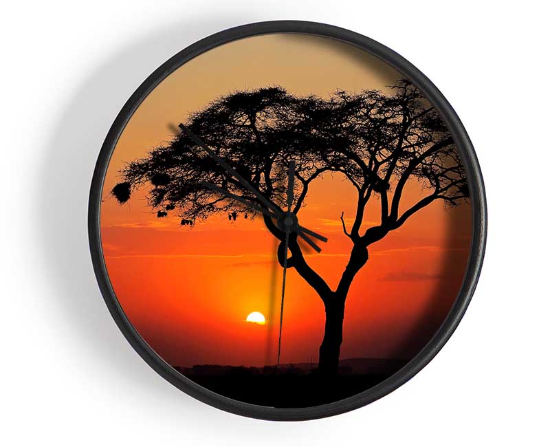 African Sunset clock made from natural bamboo with a round face, available in black, white, and natural frame colors.