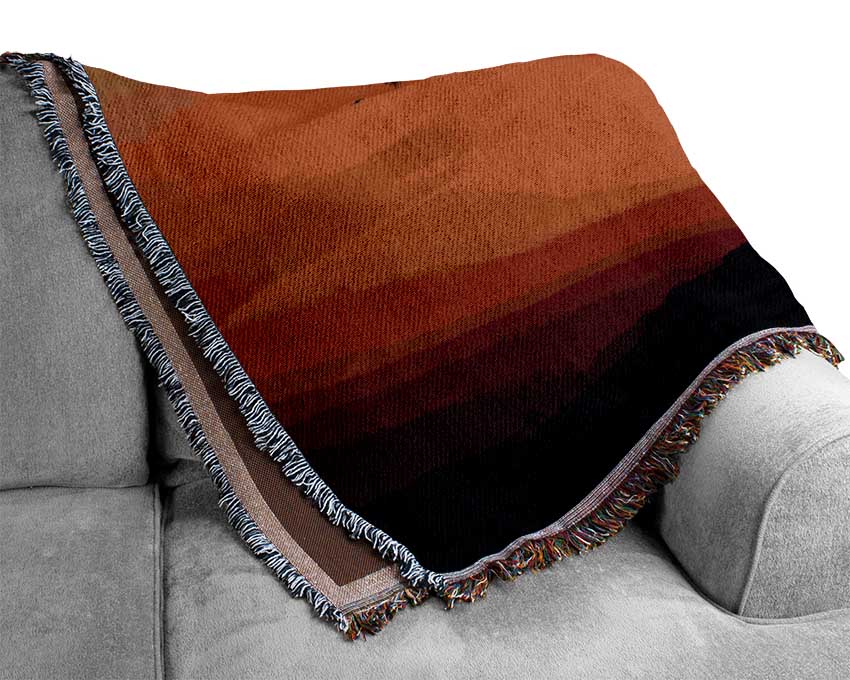 A luxurious African Sunset throw blanket made from 100% cotton, featuring a thermal weave design in rich, warm colors.