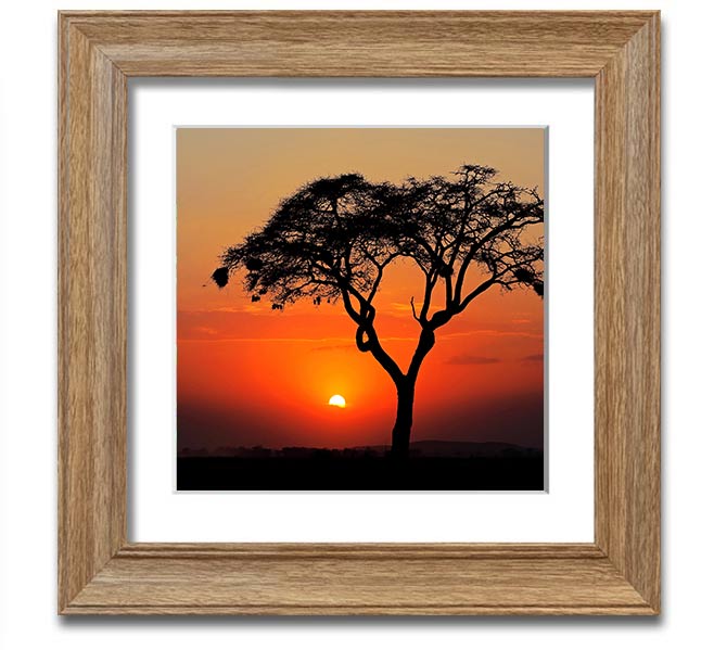 A beautifully framed print of an African sunset, showcasing vibrant colors and serene landscapes, ready to hang.