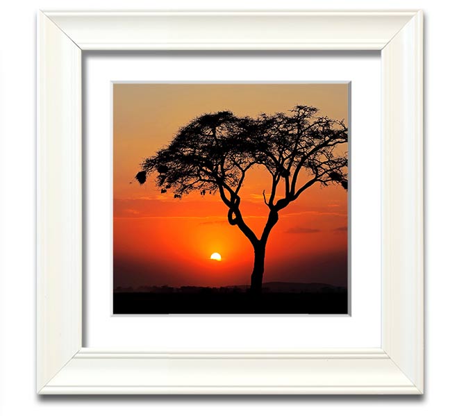 A beautifully framed print of an African sunset, showcasing vibrant colors and serene landscapes, ready to hang.