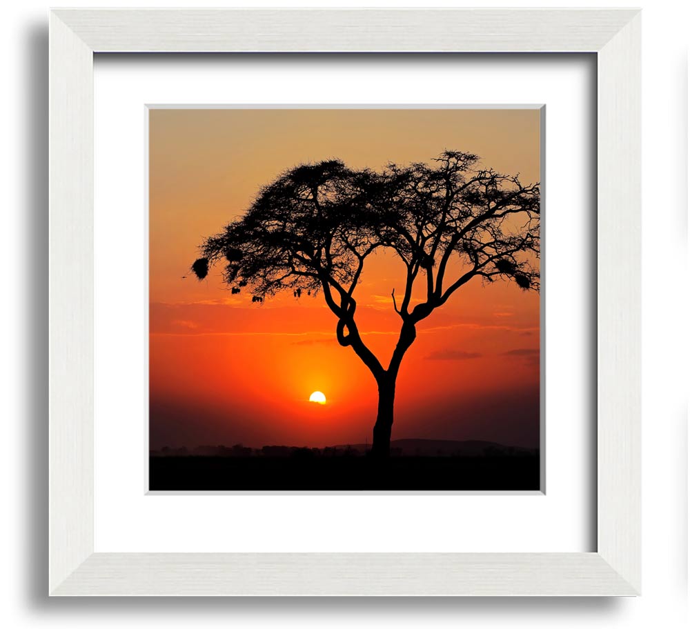 A beautifully framed print of an African sunset, showcasing vibrant colors and serene landscapes, ready to hang.