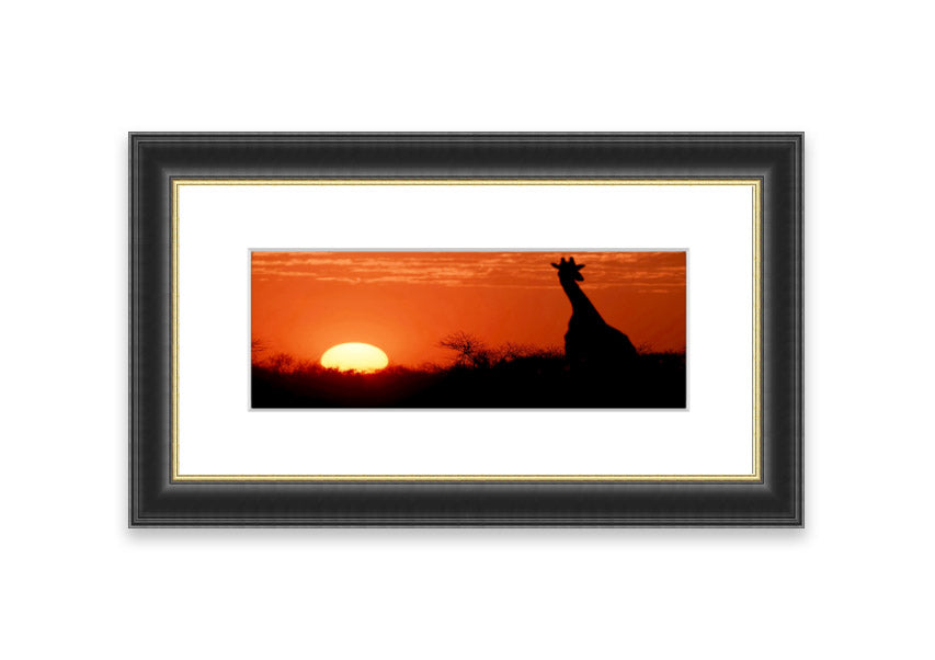 Framed print of an African sunset with a giraffe silhouette, showcasing vibrant colors and elegant design.