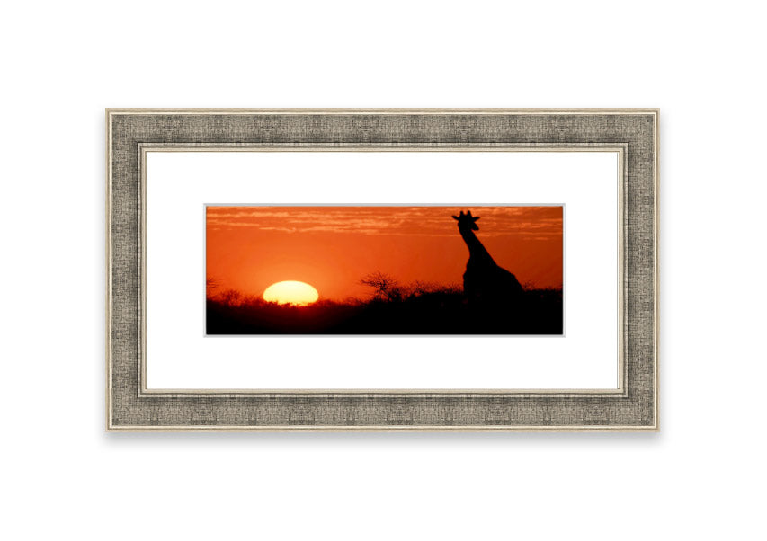 Framed print of an African sunset with a giraffe silhouette, showcasing vibrant colors and elegant design.