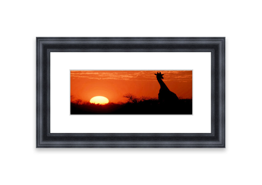 Framed print of an African sunset with a giraffe silhouette, showcasing vibrant colors and elegant design.