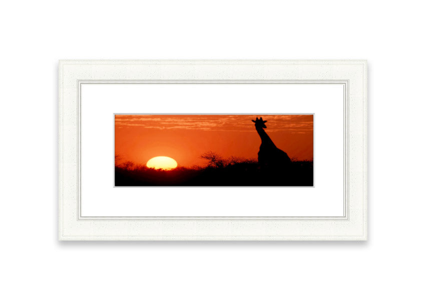 Framed print of an African sunset with a giraffe silhouette, showcasing vibrant colors and elegant design.