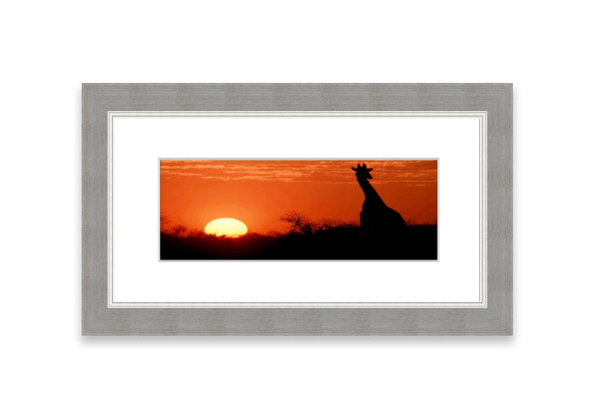 Framed print of an African sunset with a giraffe silhouette, showcasing vibrant colors and elegant design.