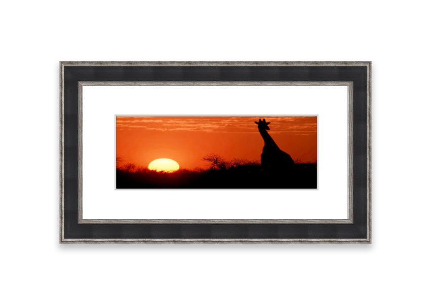 Framed print of an African sunset with a giraffe silhouette, showcasing vibrant colors and elegant design.