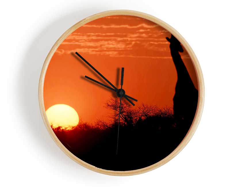 A beautifully designed African Sunset Giraffe clock made from natural bamboo, featuring a round face and clear Plexiglas lens.