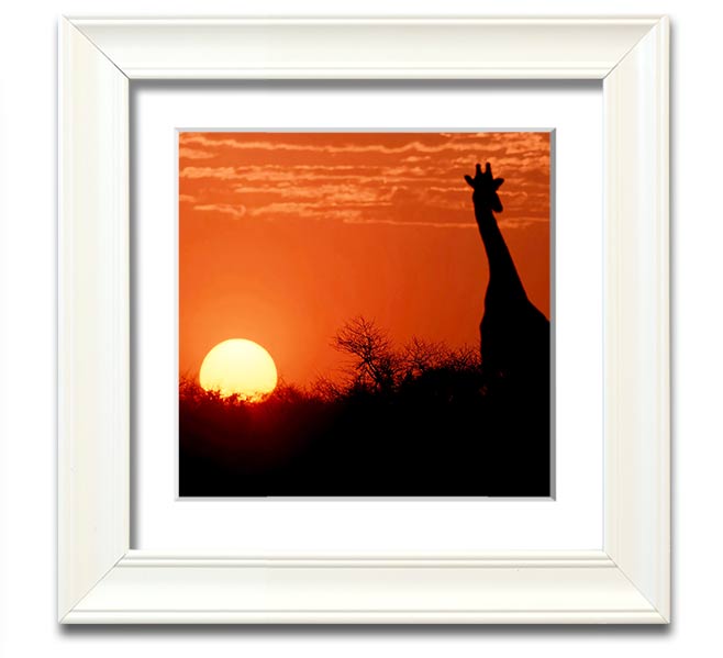 A beautifully framed print of a giraffe silhouette against a vibrant African sunset, showcasing warm colors.