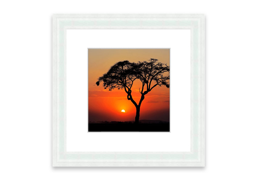 Framed print of an African sunset, showcasing vibrant colors and serene landscape, ready to hang.