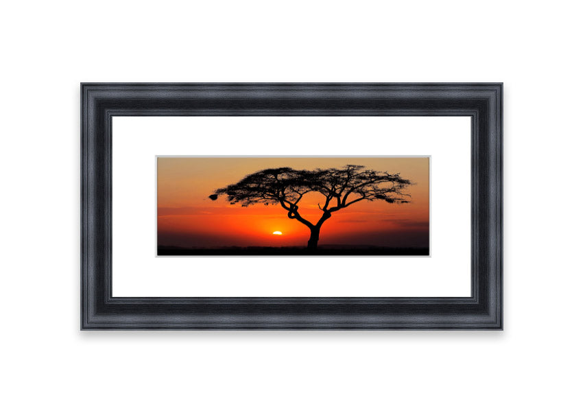 Framed print of an African sunset, showcasing vibrant colors and serene landscape, ready to hang.