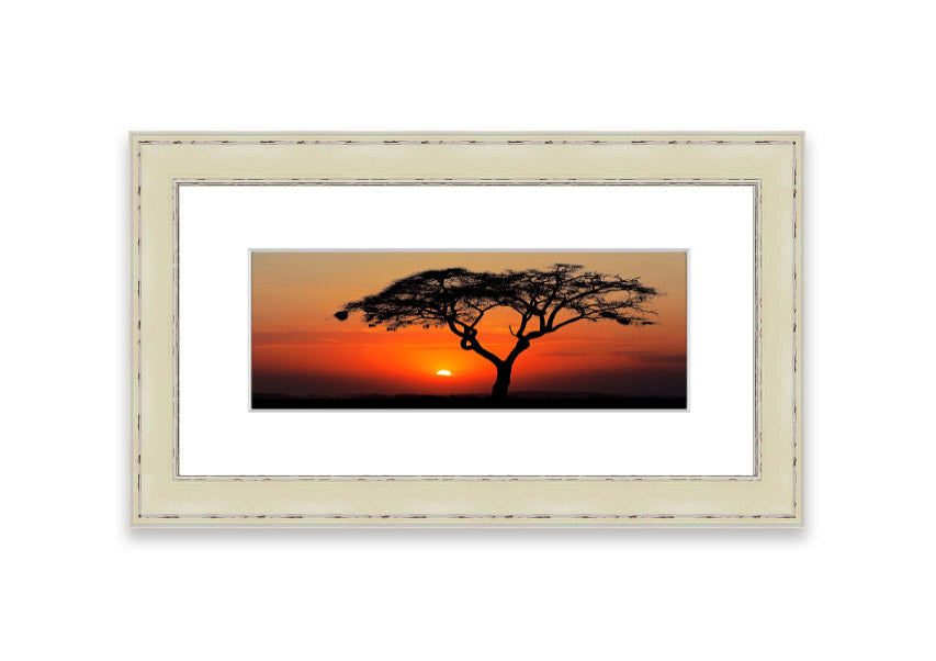 Framed print of an African sunset, showcasing vibrant colors and serene landscape, ready to hang.