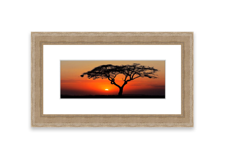 Framed print of an African sunset, showcasing vibrant colors and serene landscape, ready to hang.