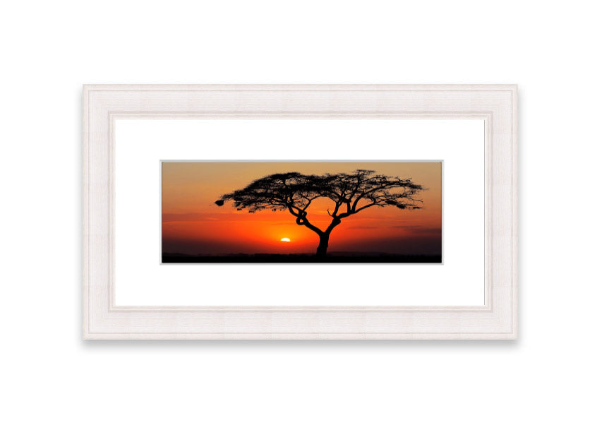 Framed print of an African sunset, showcasing vibrant colors and serene landscape, ready to hang.