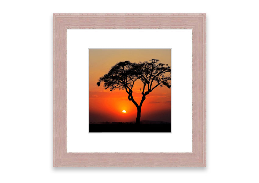 Framed print of an African sunset, showcasing vibrant colors and serene landscape, ready to hang.