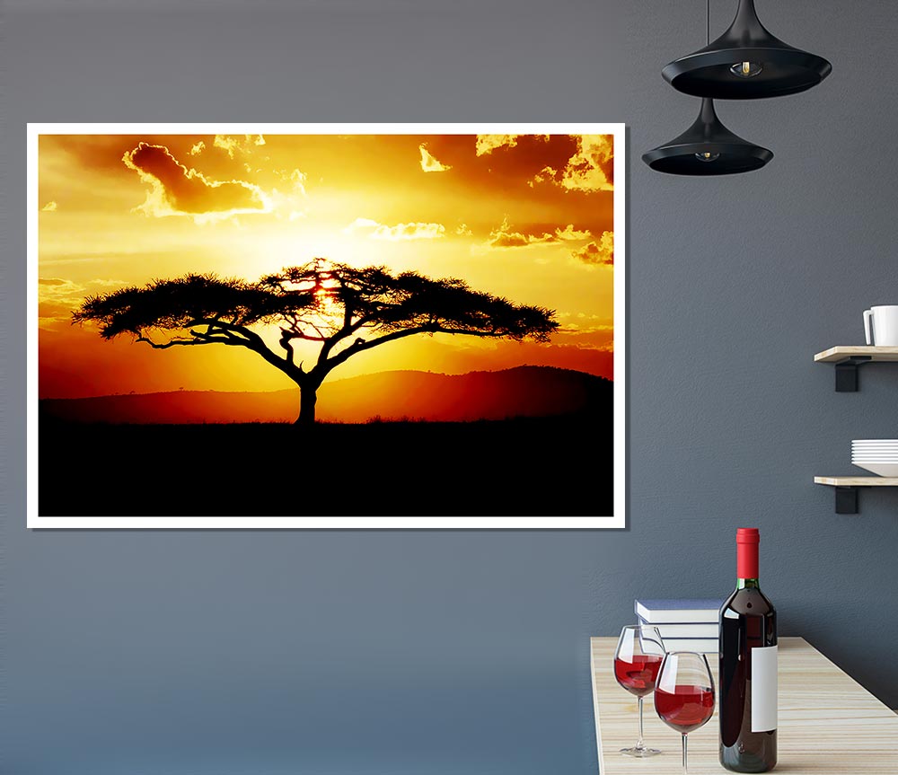 A beautiful African tree silhouetted against a vibrant sunset sky, showcasing warm hues of orange, pink, and purple.