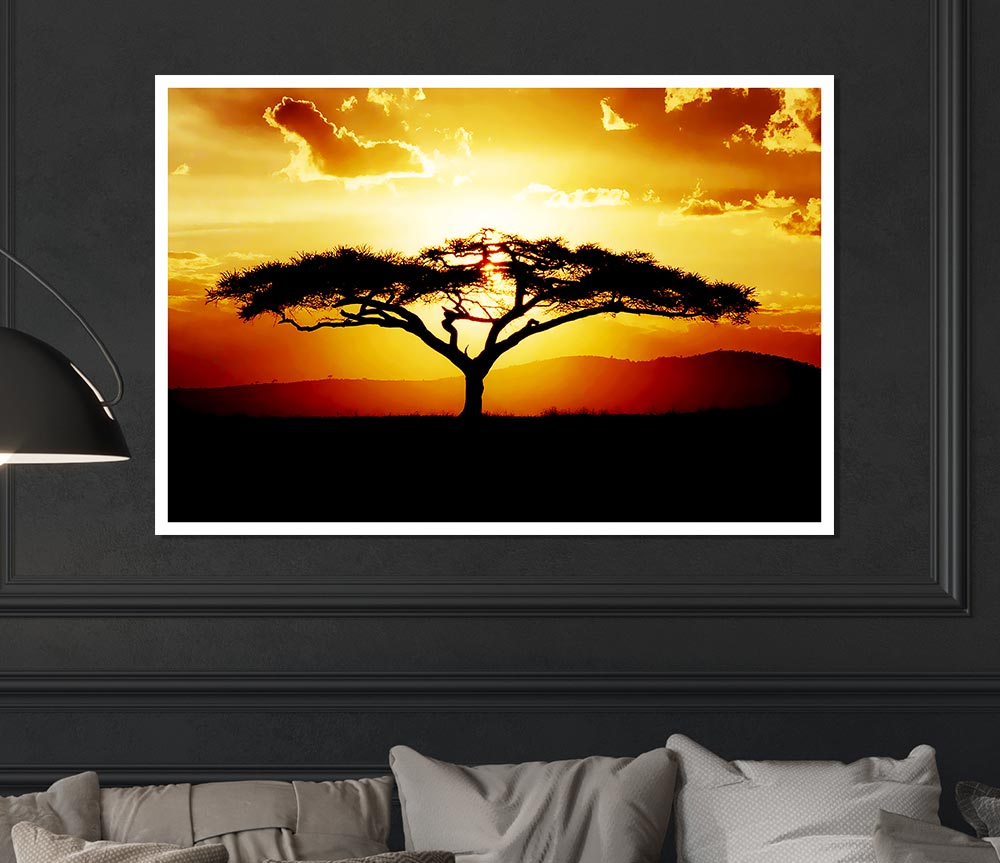 A beautiful African tree silhouetted against a vibrant sunset sky, showcasing warm hues of orange, pink, and purple.