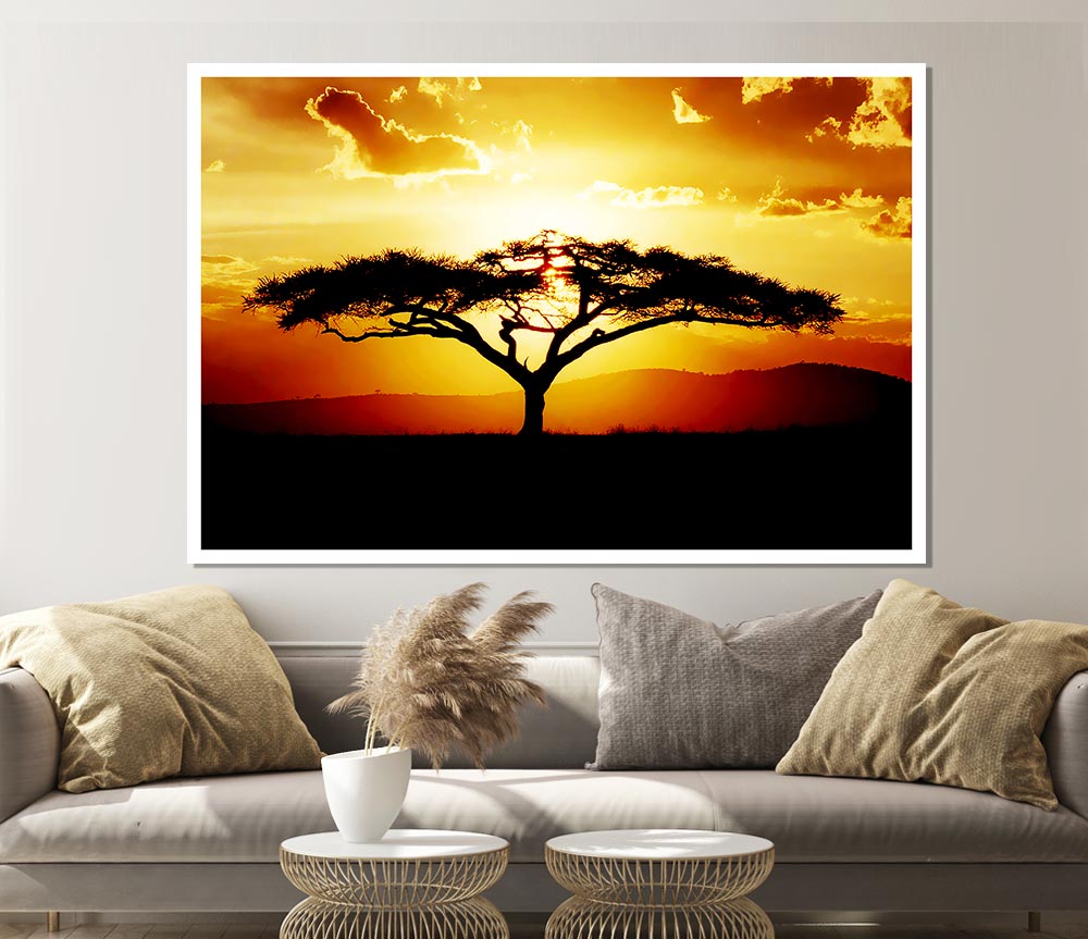 A beautiful African tree silhouetted against a vibrant sunset sky, showcasing warm hues of orange, pink, and purple.