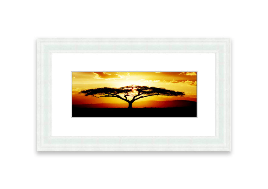 Framed print of an African tree at sunset, showcasing vibrant colors and a serene landscape.