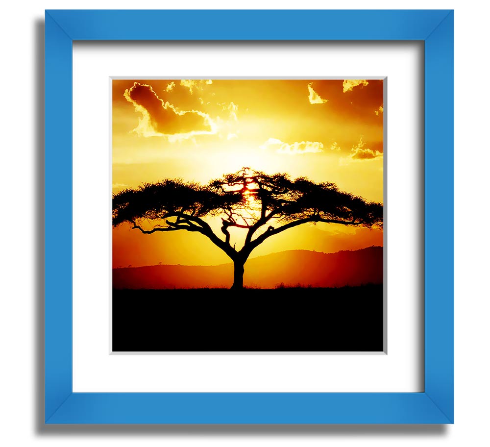 A beautifully framed print of an African tree at sunset, showcasing vibrant colors and intricate details.