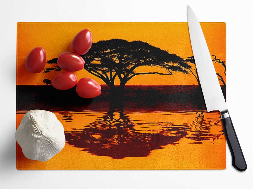 African Tree Reflection chopping board made of tempered glass with a chinchilla ripple effect finish, featuring an anti-slip base.