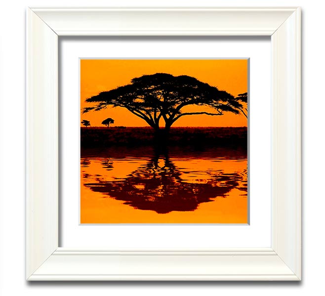 A beautifully framed print of an African tree reflecting in serene waters, showcasing vibrant colors and intricate details.