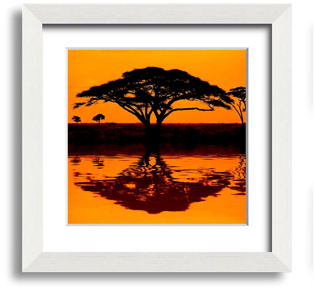 A beautifully framed print of an African tree reflecting in serene waters, showcasing vibrant colors and intricate details.